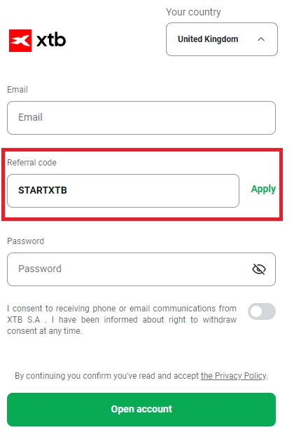 XTB UK sign-up form with the Referral code field expanded and STARTXTB entered, highlighted in red, next to the green Apply button